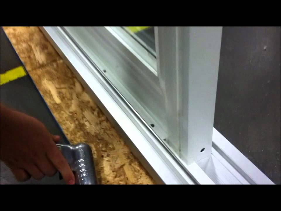 how to remove sliding glass door from track