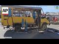 Russia drone strike hits moving bus in Kherson, injured helped into ambulances