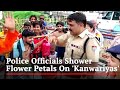 Haridwar police welcome Kanwariyas with flower petals