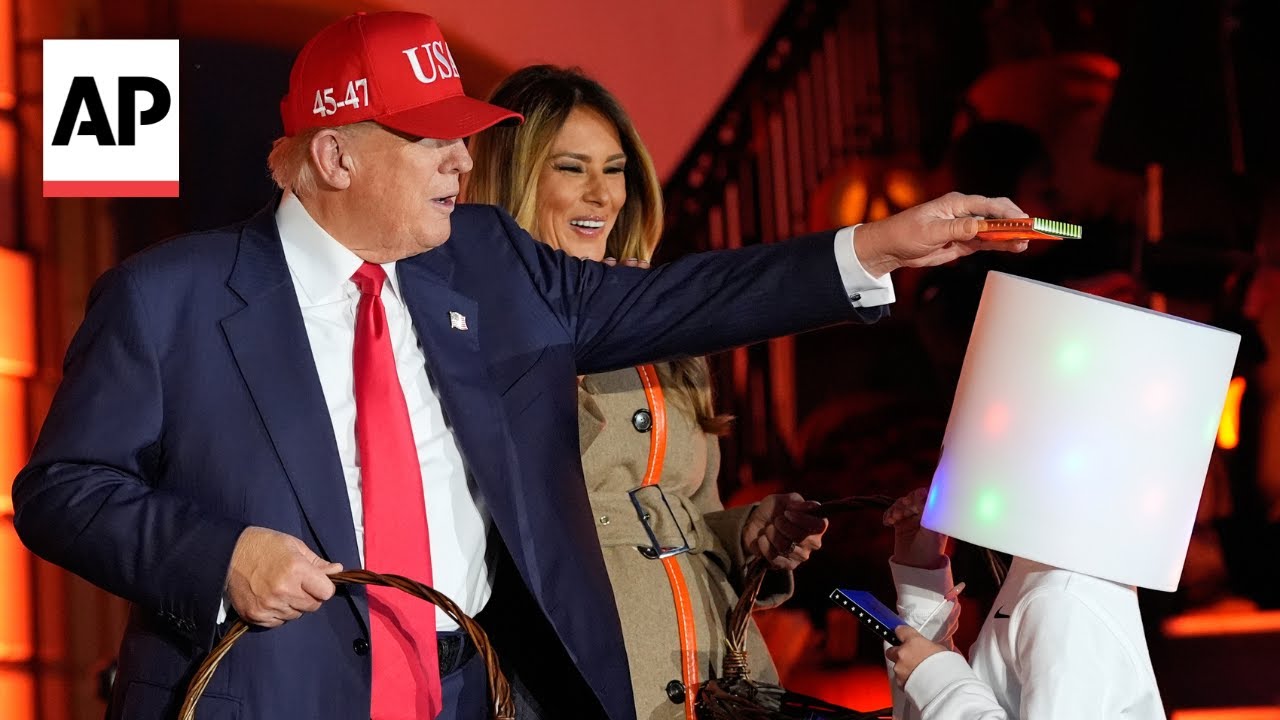 Donald and Melania Trump hand out candy at White House Halloween event