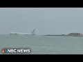U.S. military aircraft overshoots runway and lands in Hawaii bay