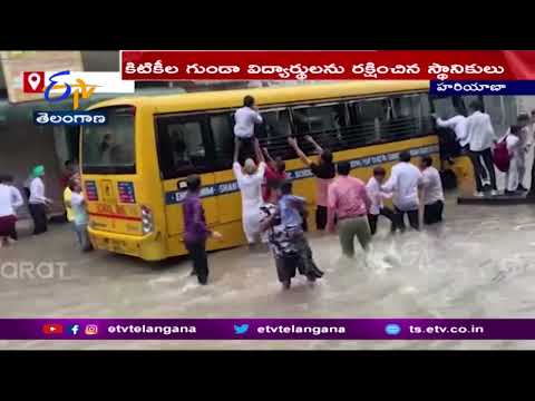 Smoke erupts from school bus on waterlogged road, locals rescue students