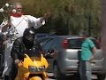 AP : Raw: Portuguese Priest Rides Motorbike on Easter