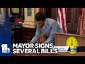 Baltimore mayor signs Harborplace, tobacco ban bills
