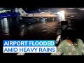 Passengers Wade Through Knee-Deep Water At Ahmedabad Airport