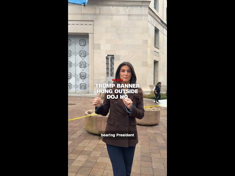 Trump banner hung outside DOJ HQ