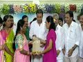 KTR distributing Bathukamma sarees to women