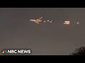Video shows flames shooting out of cargo plane in Miami