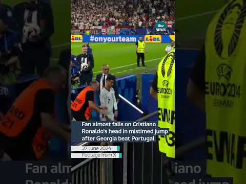 Fan almost falls on Cristiano Ronaldo's head in mistimed jump after Georgia beat Portugal| ITV News
