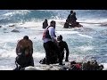Rescue team plucks migrant boat survivors off Greek island - Visuals