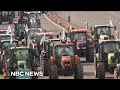 French farmers threaten to besiege Paris in tractor protest