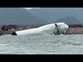 Cargo plane skids off Hong Kong runway, killing two staff | REUTERS