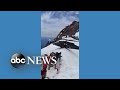 Blackhawk helicopter balances near summit of Mount Hood amid climber rescue