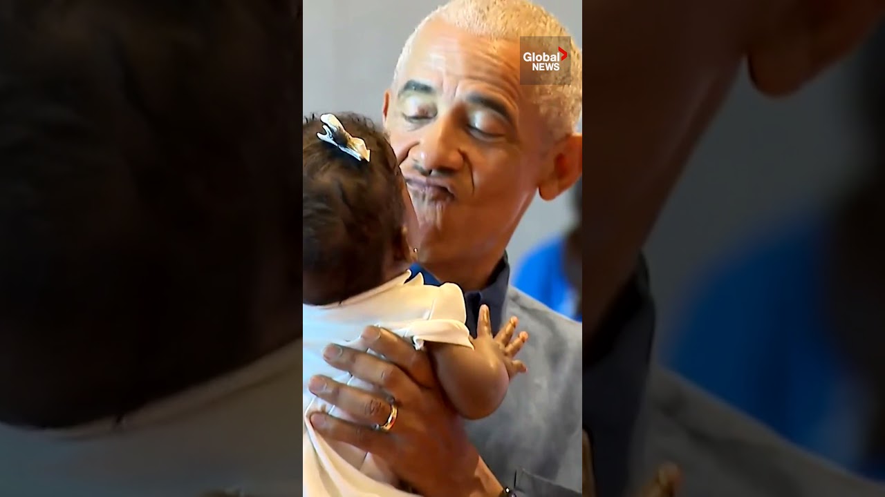 Barack and Michelle Obama greet visitors at opening of his presidential center in Chicago