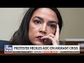 AOC heckled by protesters angry about migrant crisis: You dont care!  - 01:13 min - News - Video