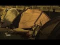 French police evict migrants from a makeshift camp in Paris ahead of Olympics  - 00:59 min - News - Video