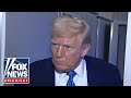 Trump defends tariffs, takes questions from reporters aboard Air Force One