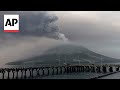 Indonesians leave homes near erupting volcano due to ash, falling rocks and tsunami possibility