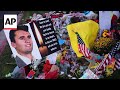People mourn Charlie Kirk at a memorial set up at Utah Valley University