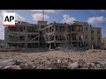 People living in Gaza assess damage to key hospital as ceasefire holds