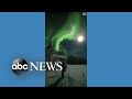 Skiers enjoy aurora borealis in Finland