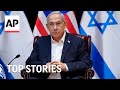 Netanyahu meetings; Veterans Day moment of silence; Christmas lights on in London | AP Top Stories