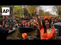 Dutch capital turns orange as revelers celebrate Kings Day with colorful canal parade