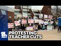 Families protest cuts to teachers, school programs