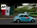 Residents of Mexico City neighborhood keep iconic Volkswagen Beetle cars up and running
