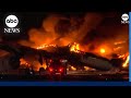 Plane engulfed in flames on runway at Tokyo airport