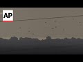 Aid drops into Gaza and smoke seen from direction of Rafah