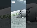 Two dead after cargo plane slides off runway in Hong Kong