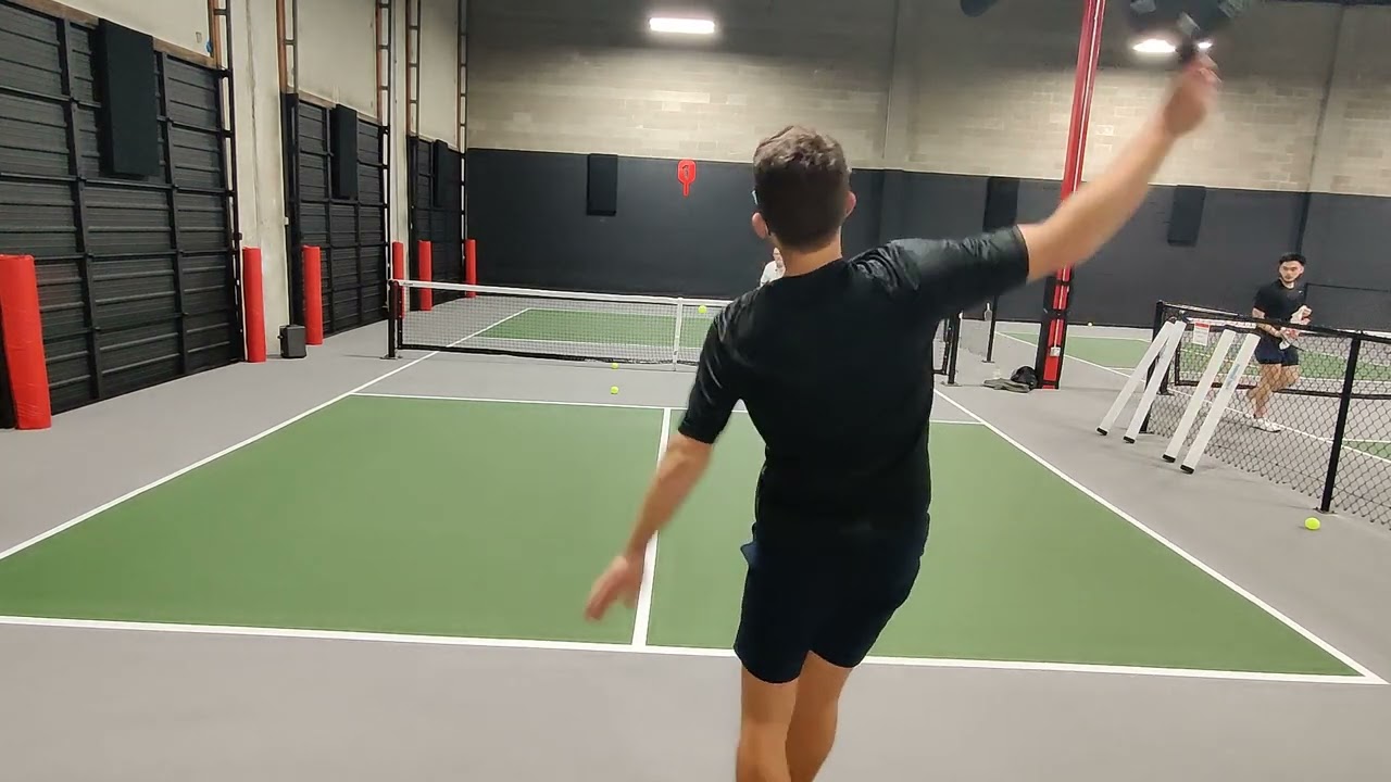 Pickleball Amateur Works on his Non Volley Zone Volleys With Professional