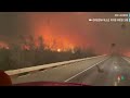 WATCH: Texas firefighters drive along highway surrounded by wildfire  - 00:44 min - News - Video