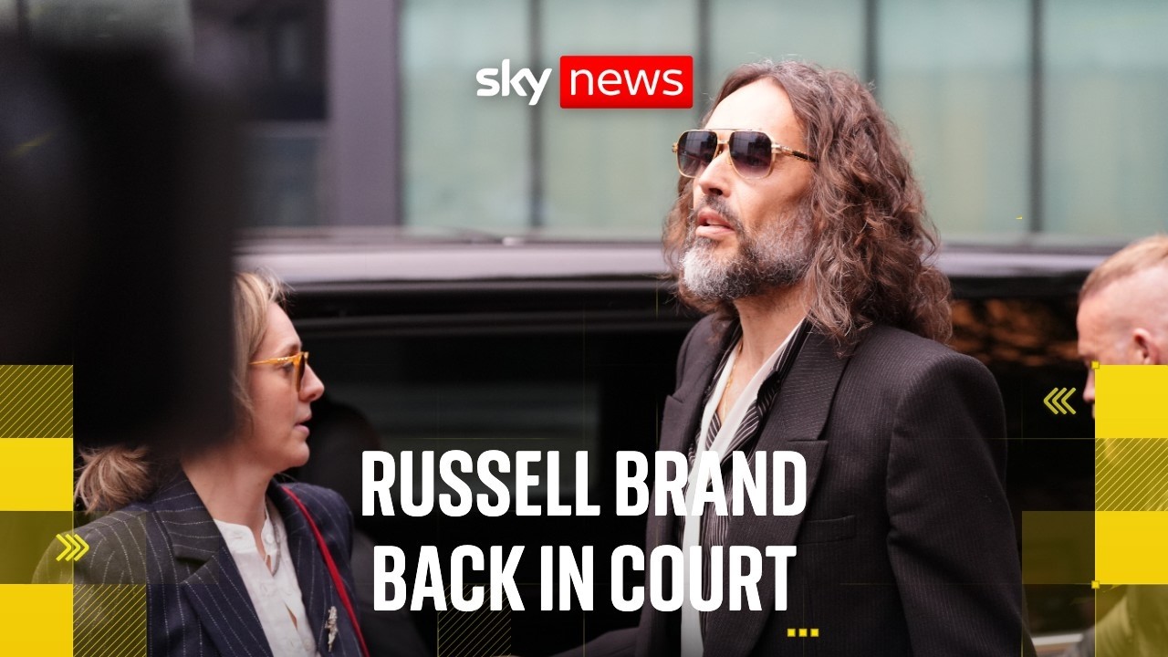 Russell Brand returns to court for start of rape trial
