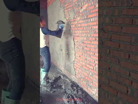 Beautiful bricklayer plastering technique