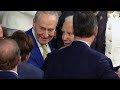 Marjorie Taylor Greene gives Biden a Laken Riley pin  - 00:16 min - News - Video