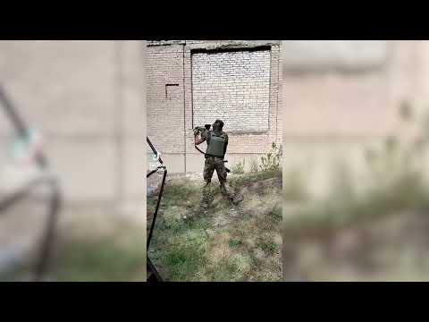 Ukrainian soldier fires with Milkor M32A1 MSGL 40mm Multi Shot Grenade Launcher