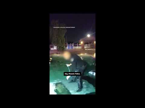 Officer rushes to save man after he drove car into pool