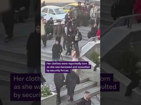 A female student strips to her underwear in protest at being assaulted by security forces in Iran