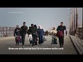 Along a coastal road in northern Gaza, Palestinians flee south hoping to find food and shelter  - 02:00 min - News - Video