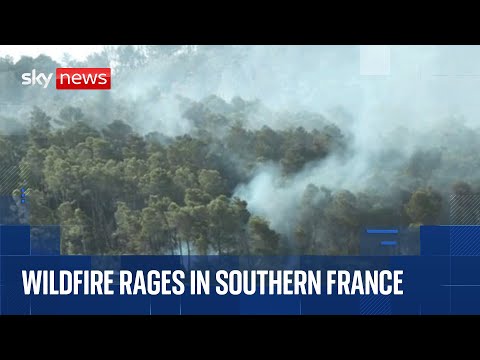 Wildfire burns in southern France forcing tourists and residents to flee