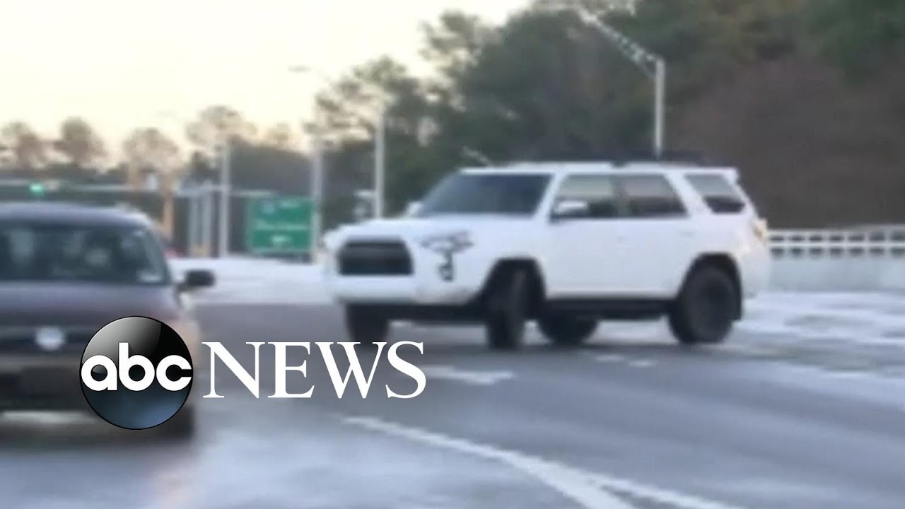 Vehicles slip and slide on icy North Carolina road