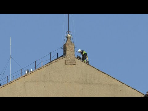 Vatican workers begin installing chimney atop Sistine Chapel for conclave | AFP