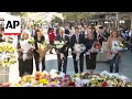 Australian PM lays flowers outside scene of Sydney stabbings