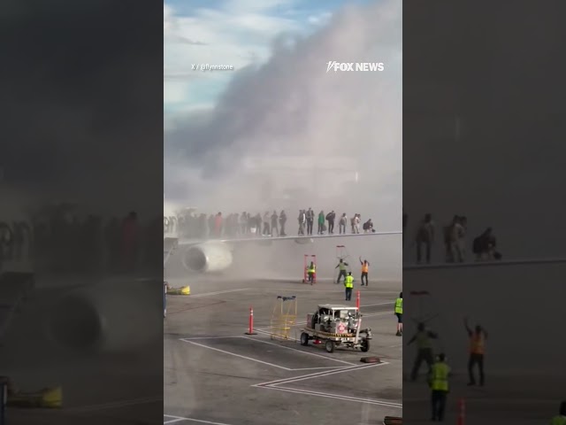 American airlines plane catches fire in Denver