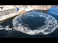 Large spinning ice disk forms on Presumpscot River in southern Maine