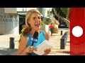Parrot surprises presenter during live broadcast, Australia -Exclusive
