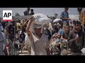 Aid workers in Gaza City distribute flour for the first time in months