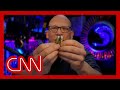 Weapons expert shows difference between live rounds and dummy rounds used on movie sets